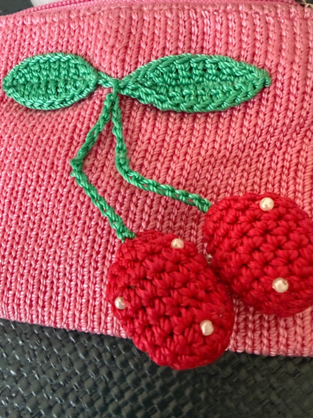 The Sak Pink Crochet Mini Bag with Green Leaf and Red Cherry Appliqué